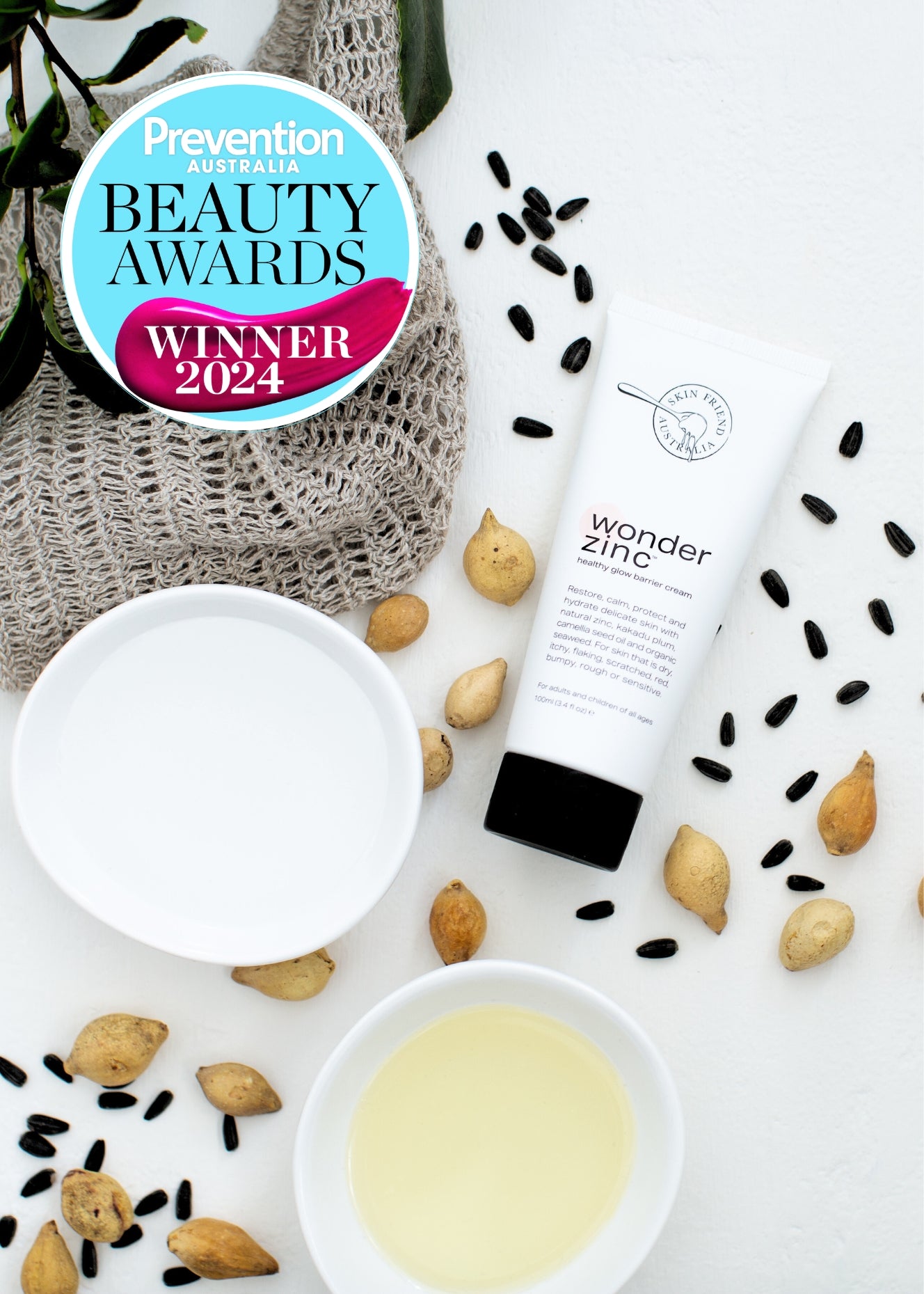 Tube of 'wonder zinc' cream with seeds and a bowl on a white background, featuring Prevention Australia Beauty Awards Winner 2024 badge.