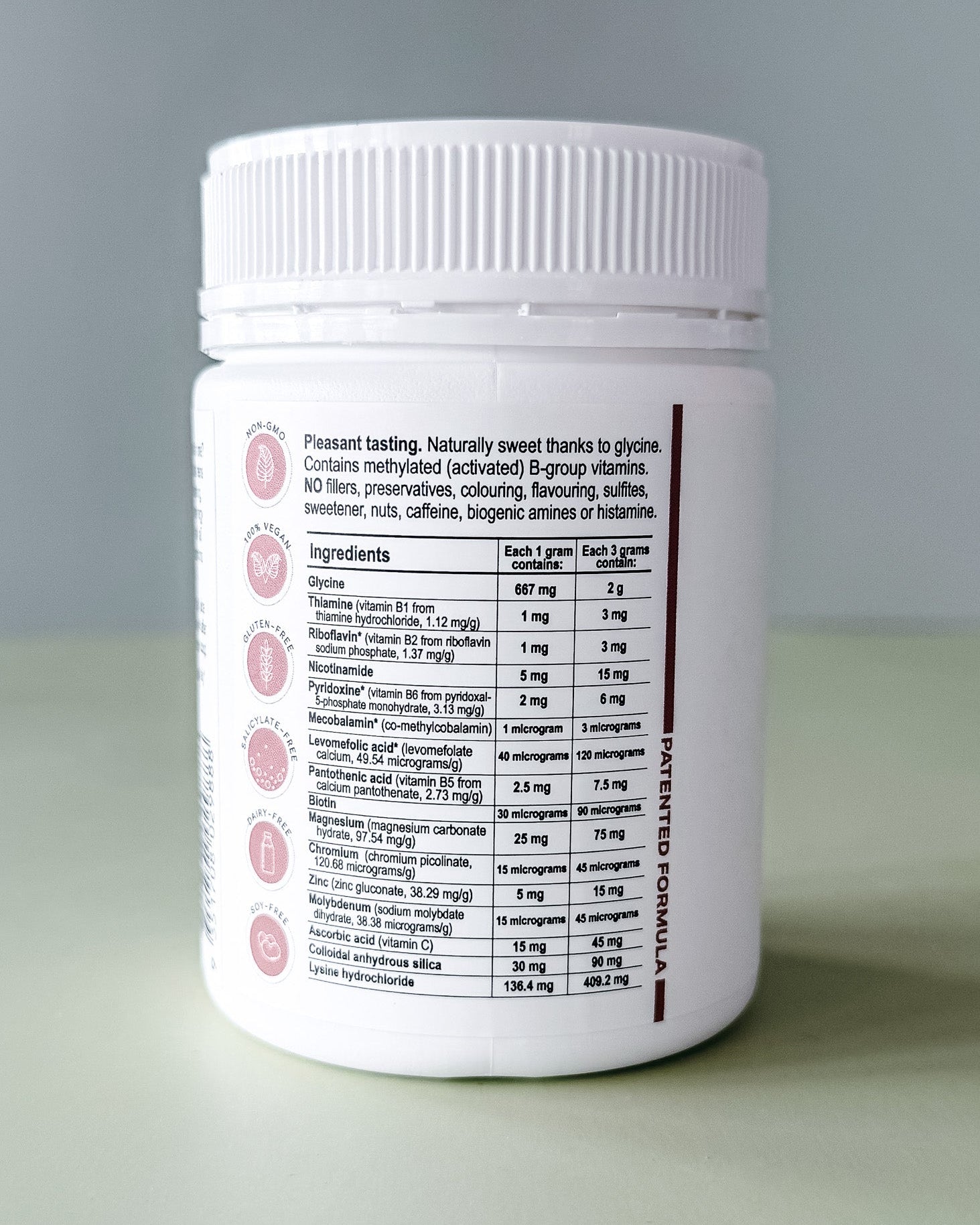 White supplement container with label on a gray background
