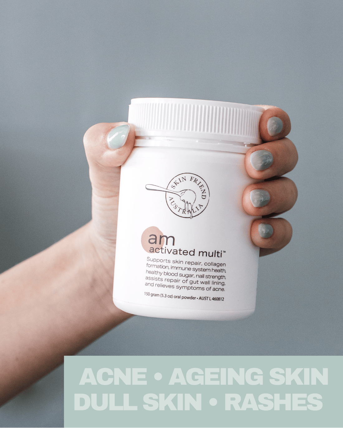 Hand holding a skincare product container with text on a gray background