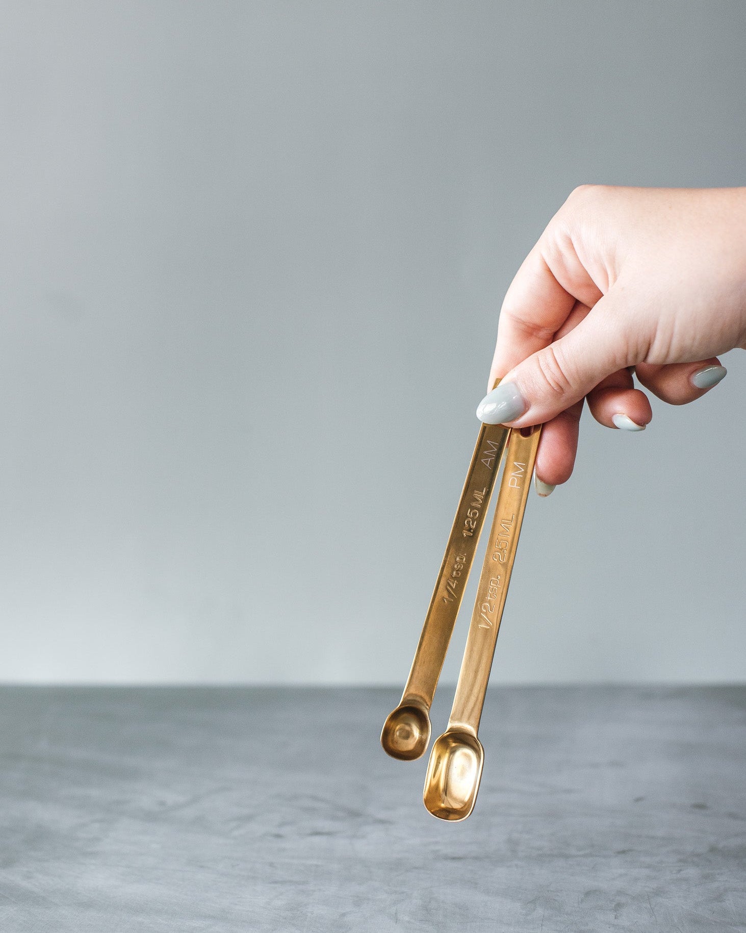two gold spoons